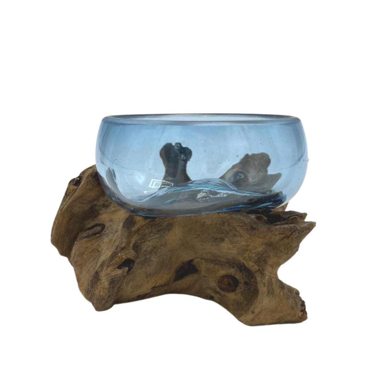 Piccola ciotola di vetro blu su legno